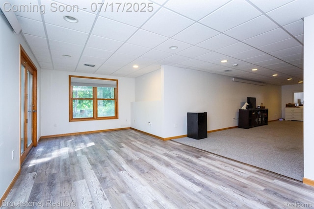 8808 Big Lake Rd, Clarkston, MI 48346 - unfurnished living room with wood finished floors, a drop ceiling, and recessed lighting