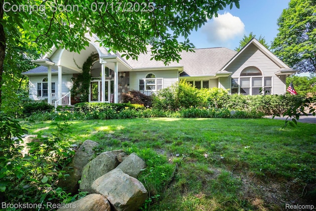 8808 Big Lake Rd, Clarkston, MI 48346 - view of front of house with a front lawn and a shingled roof