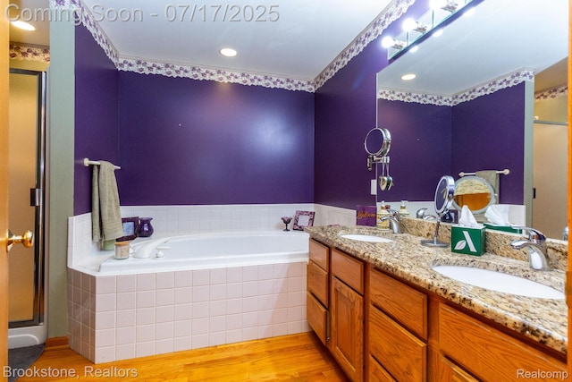 8808 Big Lake Rd, Clarkston, MI 48346 - full bath with a garden tub, a stall shower, wood finished floors, double vanity, and recessed lighting
