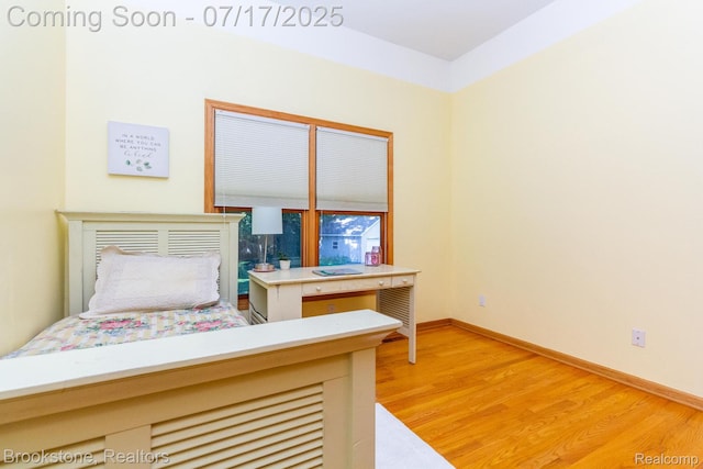 8808 Big Lake Rd, Clarkston, MI 48346 - bedroom with light wood-style floors and baseboards