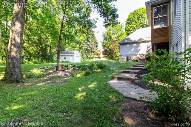 8808 Big Lake Rd, Clarkston, MI 48346 - view of grassy yard with a shed and stairway