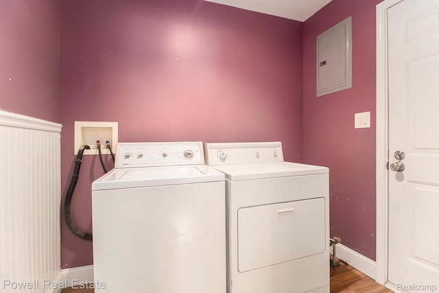 7642 Arcola Ave, Westland, MI 48185 - washroom featuring electric panel, washing machine and clothes dryer, and light wood-type flooring