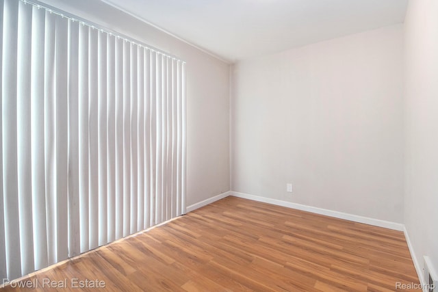 7642 Arcola Ave, Westland, MI 48185 - empty room featuring wood finished floors and baseboards