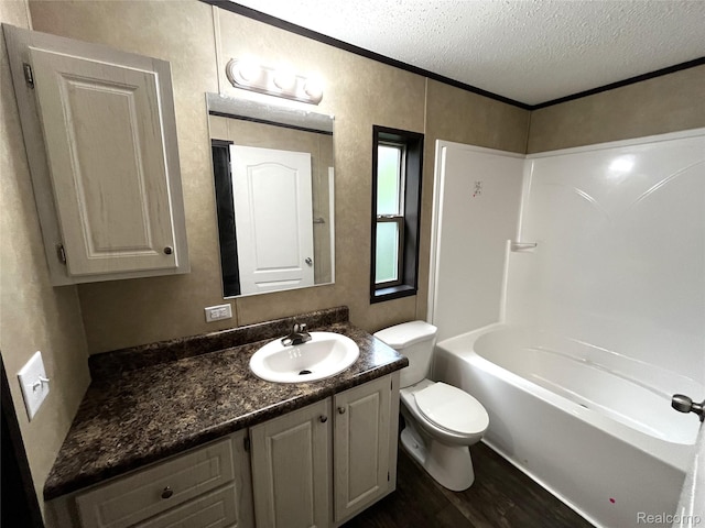 8499 LOT214 E M 71, Durand, MI 48429 - bathroom with a textured ceiling, vanity, wood finished floors, and shower / bath combination
