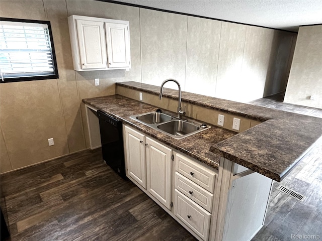 8499 LOT214 E M 71, Durand, MI 48429 - kitchen featuring black dishwasher, dark countertops, dark wood-style floors, and a textured ceiling