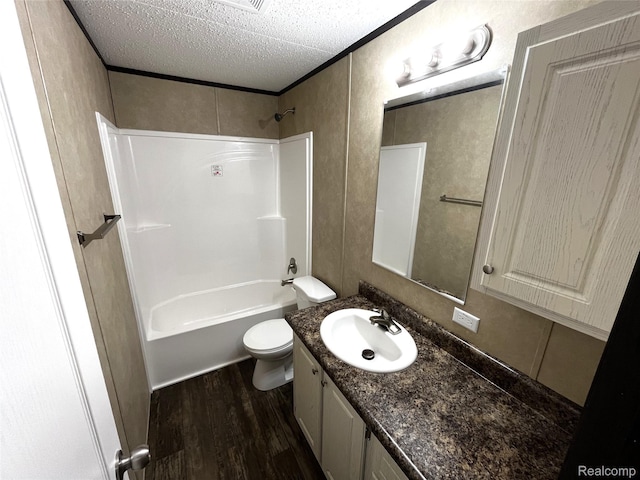 8499 LOT214 E M 71, Durand, MI 48429 - full bathroom featuring wood finished floors, vanity, bathtub / shower combination, and a textured ceiling