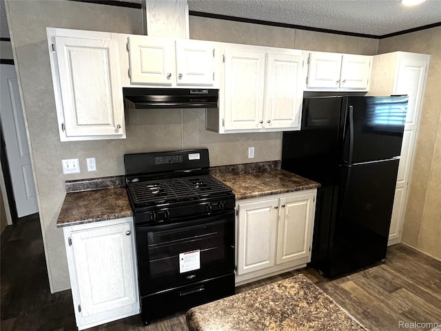 8499 LOT214 E M 71, Durand, MI 48429 - kitchen featuring black appliances, exhaust hood, dark countertops, dark wood-style floors, and a textured ceiling