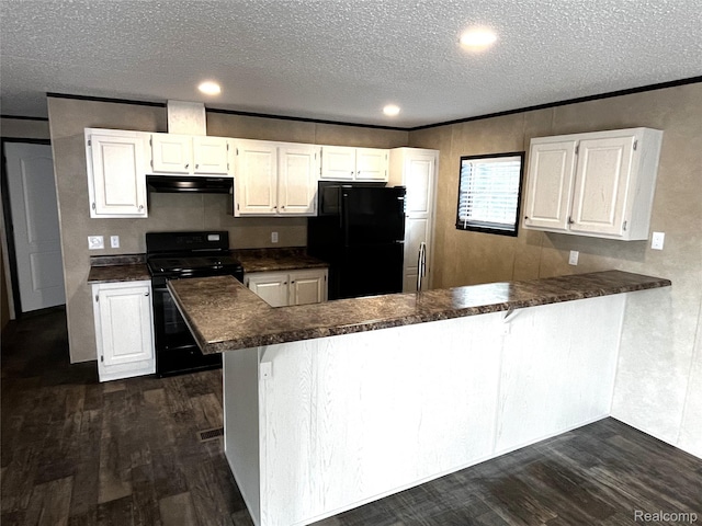 8499 LOT214 E M 71, Durand, MI 48429 - kitchen featuring black appliances, extractor fan, dark countertops, a textured ceiling, and dark wood-type flooring