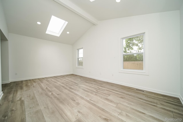 45293 Heatherwoode Ln, Macomb, MI 48044 - empty room featuring a skylight, light wood-type flooring, and recessed lighting