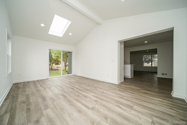 45293 Heatherwoode Ln, Macomb, MI 48044 - unfurnished living room with a skylight, light wood finished floors, and recessed lighting