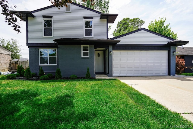 45293 Heatherwoode Ln, Macomb, MI 48044 - traditional-style home with a front lawn, driveway, brick siding, and an attached garage