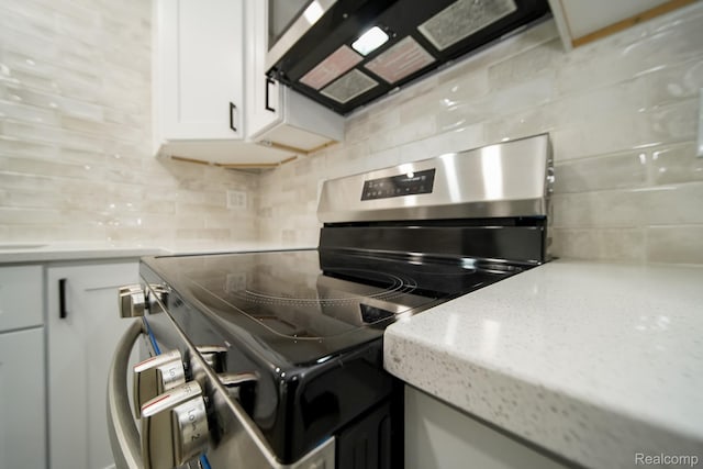 45293 Heatherwoode Ln, Macomb, MI 48044 - kitchen featuring appliances with stainless steel finishes, tasteful backsplash, white cabinets, and light stone countertops
