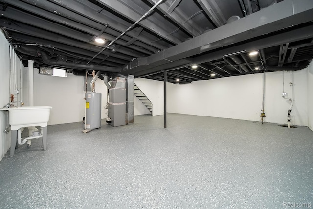 45293 Heatherwoode Ln, Macomb, MI 48044 - finished basement with water heater, heating unit, stairway, and drainage system