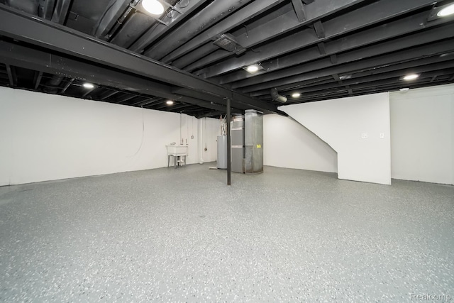 45293 Heatherwoode Ln, Macomb, MI 48044 - finished below grade area featuring gas water heater and heating unit