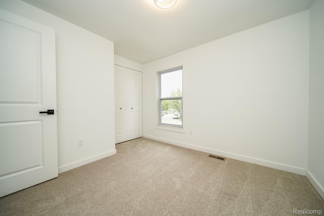 45293 Heatherwoode Ln, Macomb, MI 48044 - unfurnished bedroom featuring carpet and a closet