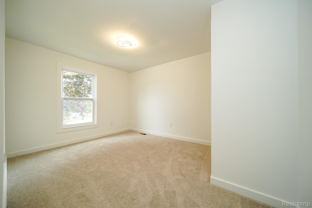 45293 Heatherwoode Ln, Macomb, MI 48044 - empty room featuring baseboards and light colored carpet