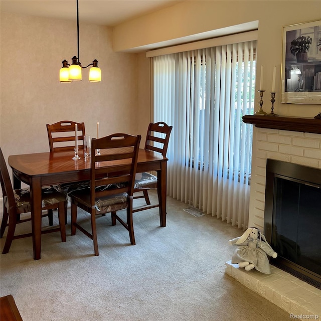 44736 Lynn Dr, Plymouth, MI 48170 - carpeted dining room with a fireplace and a chandelier