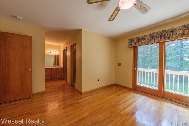 2465 Texter Rd, Leonard, MI 48367 - spare room with light wood-style flooring and ceiling fan
