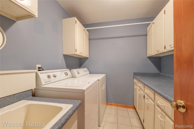 2465 Texter Rd, Leonard, MI 48367 - laundry area with cabinet space, washing machine and clothes dryer, and light tile patterned flooring