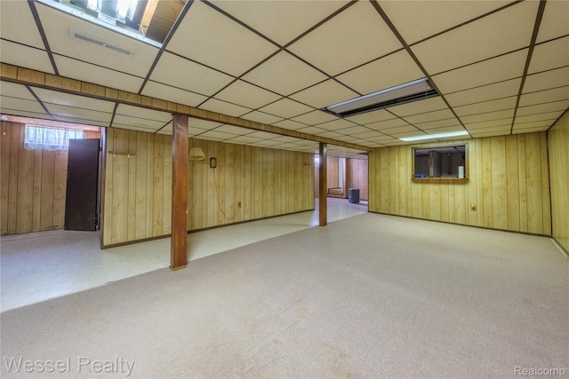 2465 Texter Rd, Leonard, MI 48367 - basement with wood walls, carpet flooring, and a drop ceiling