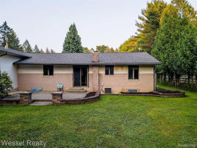 2465 Texter Rd, Leonard, MI 48367 - back of house with a chimney, a yard, brick siding, and roof with shingles
