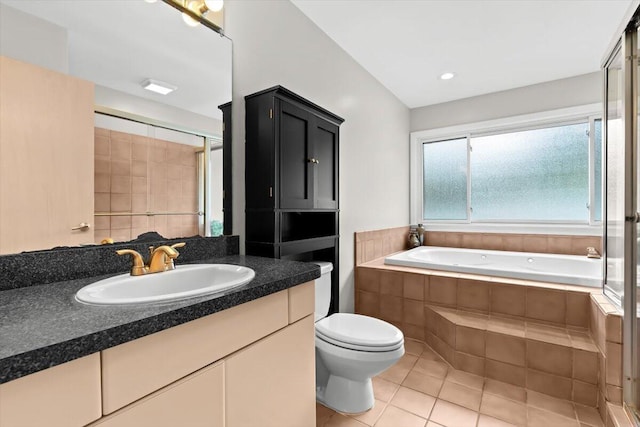 1683 Majon Dr, Highland, MI 48356 - bathroom featuring vanity, tile patterned flooring, a garden tub, and a shower with door