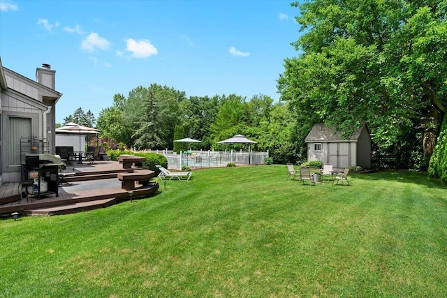 1683 Majon Dr, Highland, MI 48356 - view of yard featuring a storage shed, a deck, a gazebo, and outdoor dining area