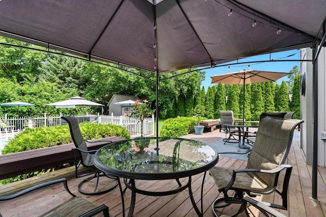 1683 Majon Dr, Highland, MI 48356 - wooden terrace featuring outdoor dining area