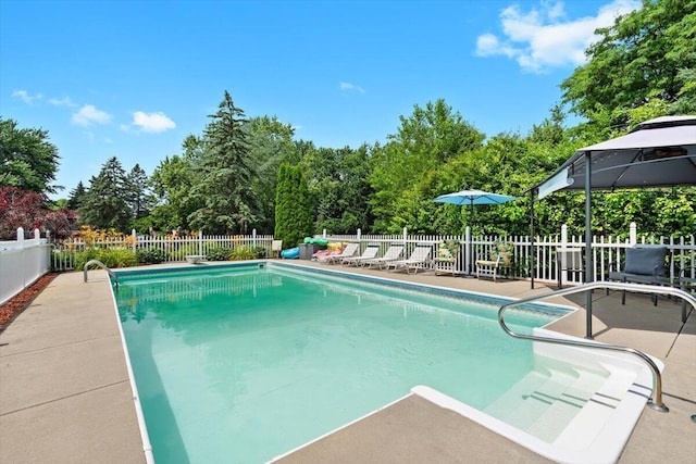 1683 Majon Dr, Highland, MI 48356 - view of pool featuring a fenced backyard, a patio area, a gazebo, and view of scattered trees