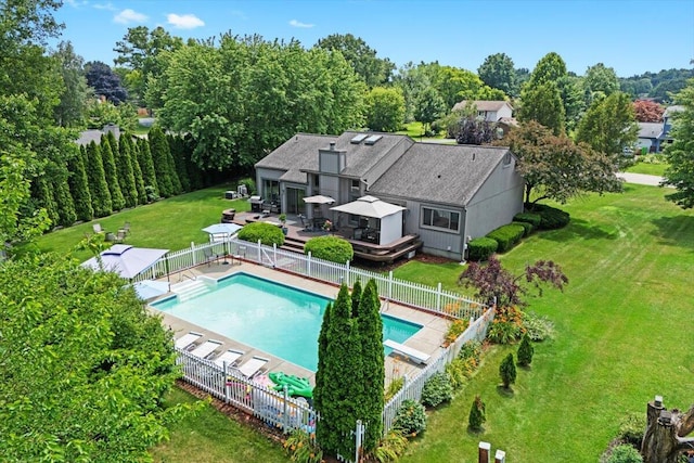 1683 Majon Dr, Highland, MI 48356 - view of swimming pool featuring a wooden deck, a fenced backyard, and a diving board