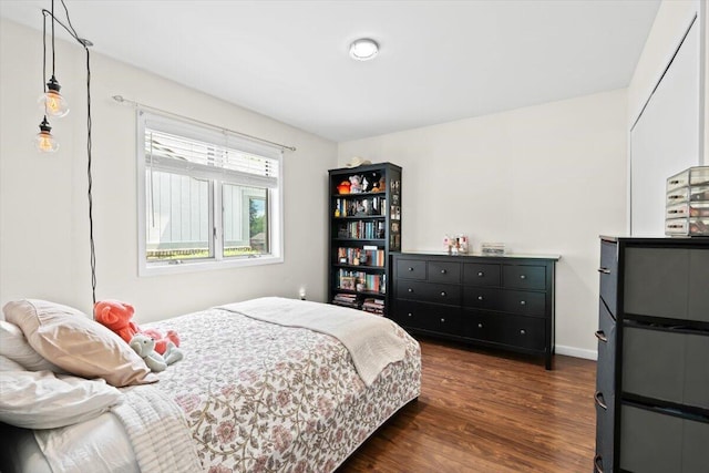 1683 Majon Dr, Highland, MI 48356 - bedroom with dark wood-type flooring and baseboards