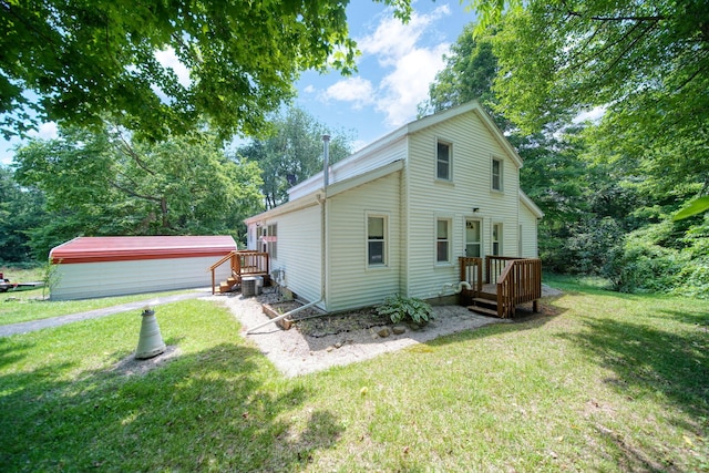 1533 E Munger Rd, Tecumseh, MI 49286 - rear view of house featuring a yard