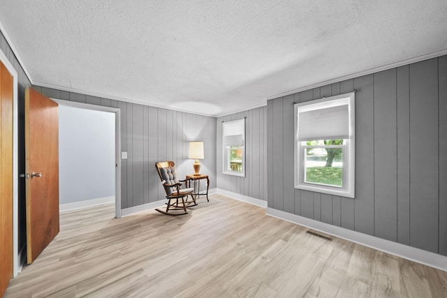 1533 E Munger Rd, Tecumseh, MI 49286 - living area featuring a textured ceiling and wood finished floors