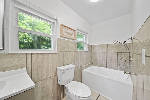 1533 E Munger Rd, Tecumseh, MI 49286 - full bath with tile walls, a tub to relax in, vanity, and wainscoting