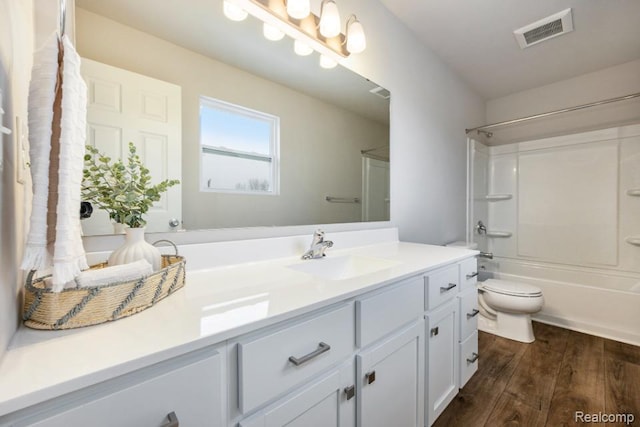 8377 Majestic Blvd, Fowlerville, MI 48836 - bathroom featuring vanity, wood finished floors, and shower / washtub combination