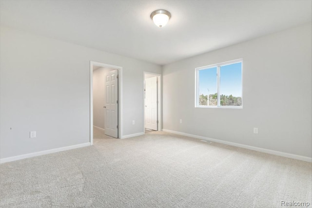 8377 Majestic Blvd, Fowlerville, MI 48836 - unfurnished bedroom with light carpet and baseboards