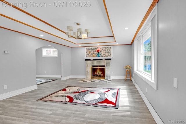 24370 Eureka Ave, Warren, MI 48091 - living area featuring plenty of natural light, a chandelier, wood finished floors, arched walkways, and recessed lighting