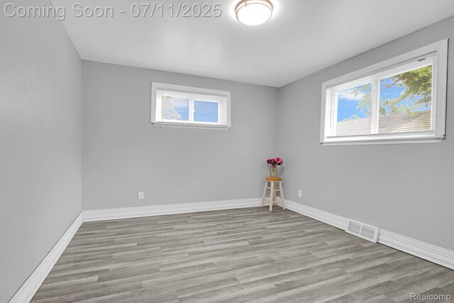 24370 Eureka Ave, Warren, MI 48091 - unfurnished room with plenty of natural light and wood finished floors