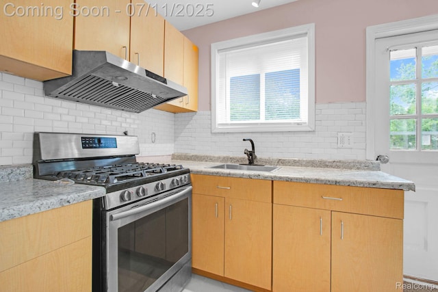 24370 Eureka Ave, Warren, MI 48091 - kitchen with stainless steel gas range, range hood, decorative backsplash, light stone countertops, and light brown cabinetry