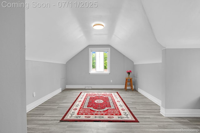 24370 Eureka Ave, Warren, MI 48091 - additional living space featuring vaulted ceiling and wood finished floors