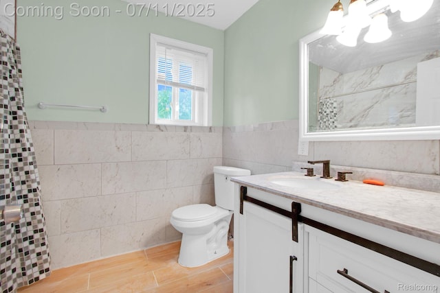 24370 Eureka Ave, Warren, MI 48091 - bathroom featuring vanity, tile walls, a chandelier, a shower with shower curtain, and wainscoting