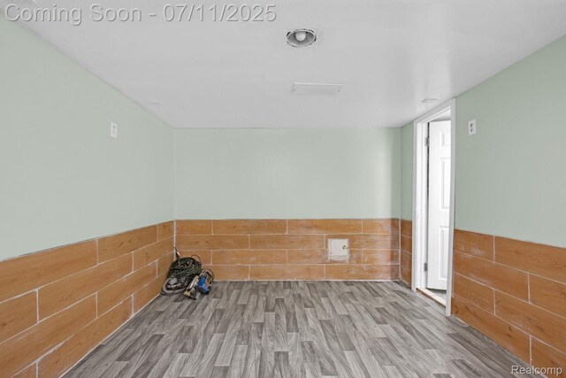 24370 Eureka Ave, Warren, MI 48091 - unfurnished room featuring wood finished floors and a wainscoted wall