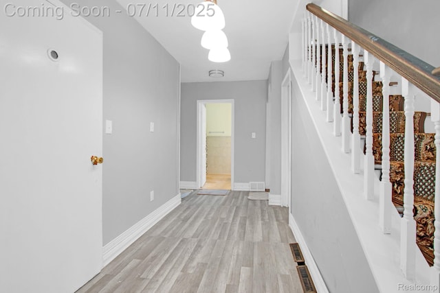 24370 Eureka Ave, Warren, MI 48091 - corridor featuring light wood-style floors and stairs