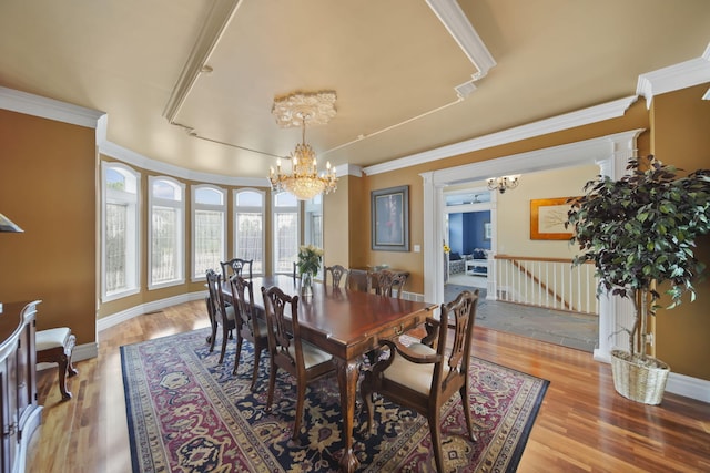 8321 Odowling Dr, Onsted, MI 49265 - dining area featuring a chandelier, wood finished floors, and crown molding