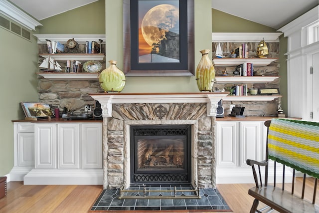 8321 Odowling Dr, Onsted, MI 49265 - detailed view of wood finished floors and a stone fireplace