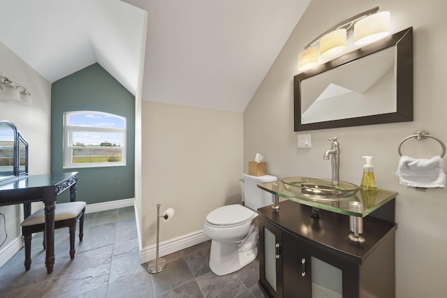 8321 Odowling Dr, Onsted, MI 49265 - bathroom featuring vaulted ceiling, vanity, and stone finish floors