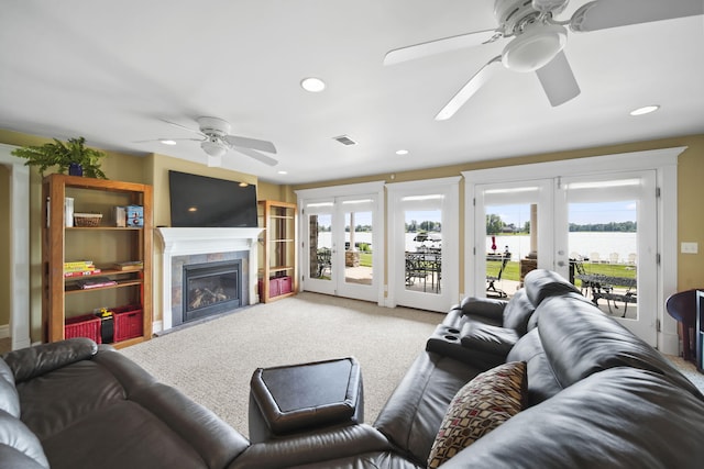 8321 Odowling Dr, Onsted, MI 49265 - living area featuring french doors, a ceiling fan, healthy amount of natural light, carpet flooring, and recessed lighting