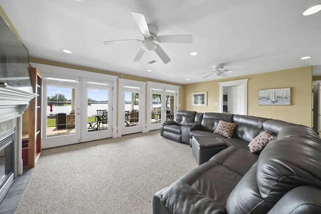 8321 Odowling Dr, Onsted, MI 49265 - living room featuring french doors, a fireplace, a ceiling fan, recessed lighting, and carpet floors