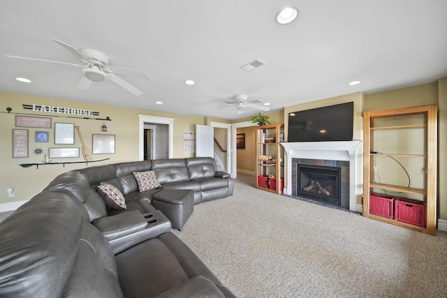 8321 Odowling Dr, Onsted, MI 49265 - carpeted living room featuring a ceiling fan, recessed lighting, a tiled fireplace, and stairway