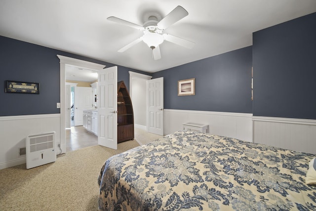 8321 Odowling Dr, Onsted, MI 49265 - carpeted bedroom with wainscoting and a ceiling fan